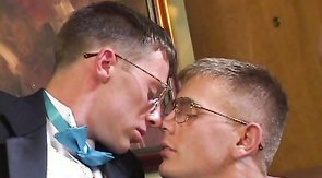 Guys in black suits are wanking and sucking on the cam