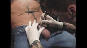 Sexy mate is making a nice tattoo right on the balls