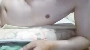 Asian grandpa jerking off on the bed