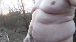 Chubby masturbates in the woods