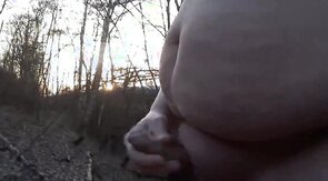 Chubby masturbates in the woods