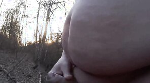 Chubby masturbates in the woods