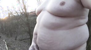 Chubby masturbates in the woods