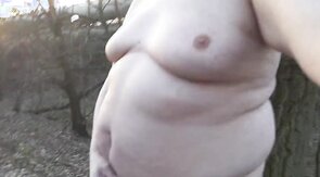 Chubby masturbates in the woods