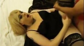 crosdresser jerks cock while fucked by 2 men