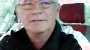 Older man cruise in car