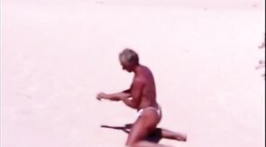 Tanned guy on beach in tiny string thong (temporarily!)