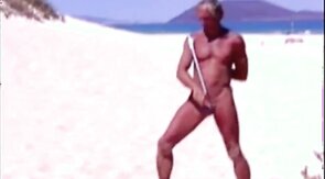 Tanned guy on beach in tiny string thong (temporarily!)