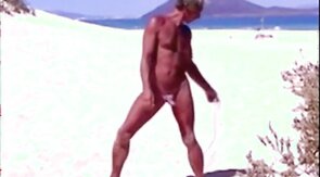 Tanned guy on beach in tiny string thong (temporarily!)