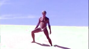 Tanned guy on beach in tiny string thong (temporarily!)