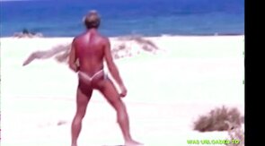 Tanned guy on beach in tiny string thong (temporarily!)