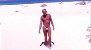 Tanned guy on beach in tiny string thong (temporarily!)