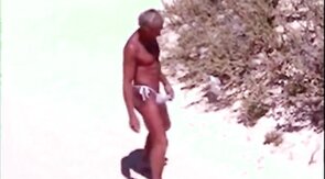 Tanned guy on beach in tiny string thong (temporarily!)