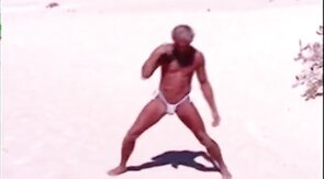 Tanned guy on beach in tiny string thong (temporarily!)