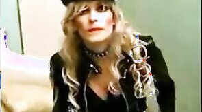 Sissy Sandracduk posing in leather outfit