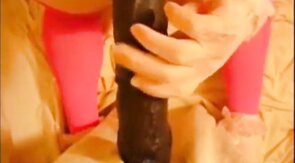 bitch in miniskirt and pink stockings riding her big dildo