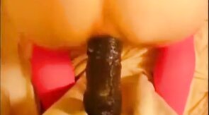 bitch in miniskirt and pink stockings riding her big dildo