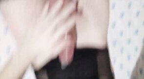 Filling a condom with cum,  wearing sexy body and stockings.