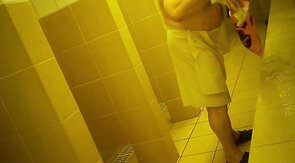 Naked men in public pool shower