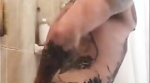 Tatted Hunk Fucks Dildo in Shower Until He Cums