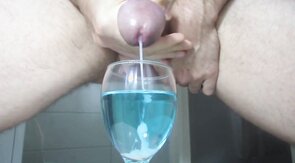 Ejaculating creamy cumshot into a cup of water #2