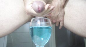 Ejaculating creamy cumshot into a cup of water #2