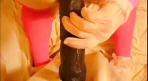 bitch in miniskirt and pink stockings riding her big dildo