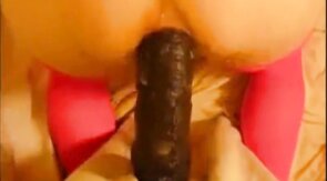 bitch in miniskirt and pink stockings riding her big dildo