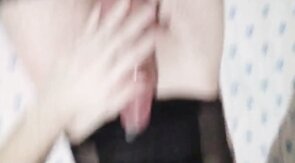 Filling a condom with cum,  wearing sexy body and stockings.