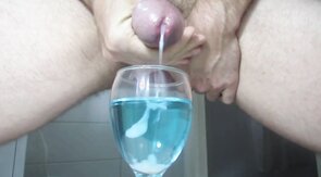 Ejaculating creamy cumshot into a cup of water #2