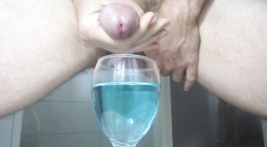 Ejaculating creamy cumshot into a cup of water #2