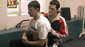 Two young mates are supporting each other in the gym