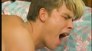 Sweet boy is getting fucked by two massive poles