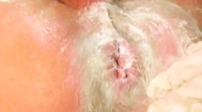 His tight anal hole is getting fucked with a giant dildo!