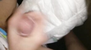Twink cumming his wet diaper