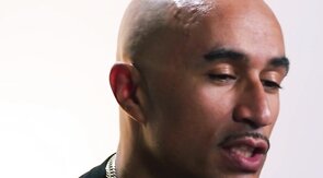 Black solo jock with tattooed body masturbates with toy