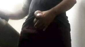 MILKING HIS BIG UNCUT BRAZILIAN DONKEY DICK AT WORK