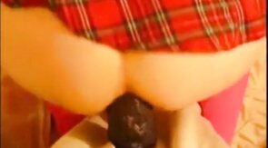 bitch in miniskirt and pink stockings riding her big dildo