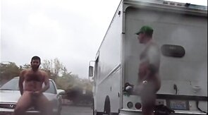 Public Rainy Stroking in a Parking Lot by Two Horny Men