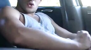 Big-cock jock strokes in his car